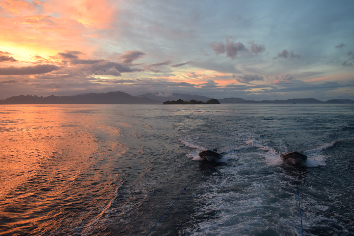 Liveaboard dinghies at sunset in Komodo