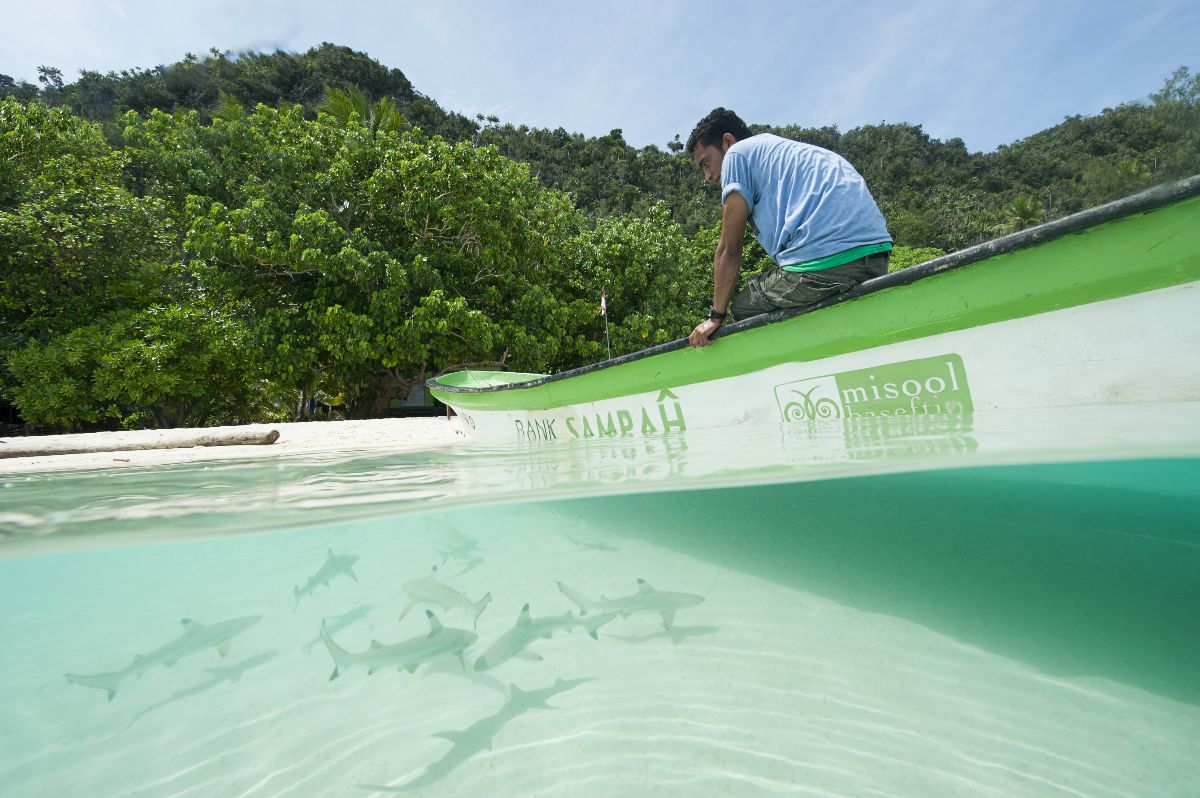 Ranger and boat of Misool Eco Resort at shark sanctuary