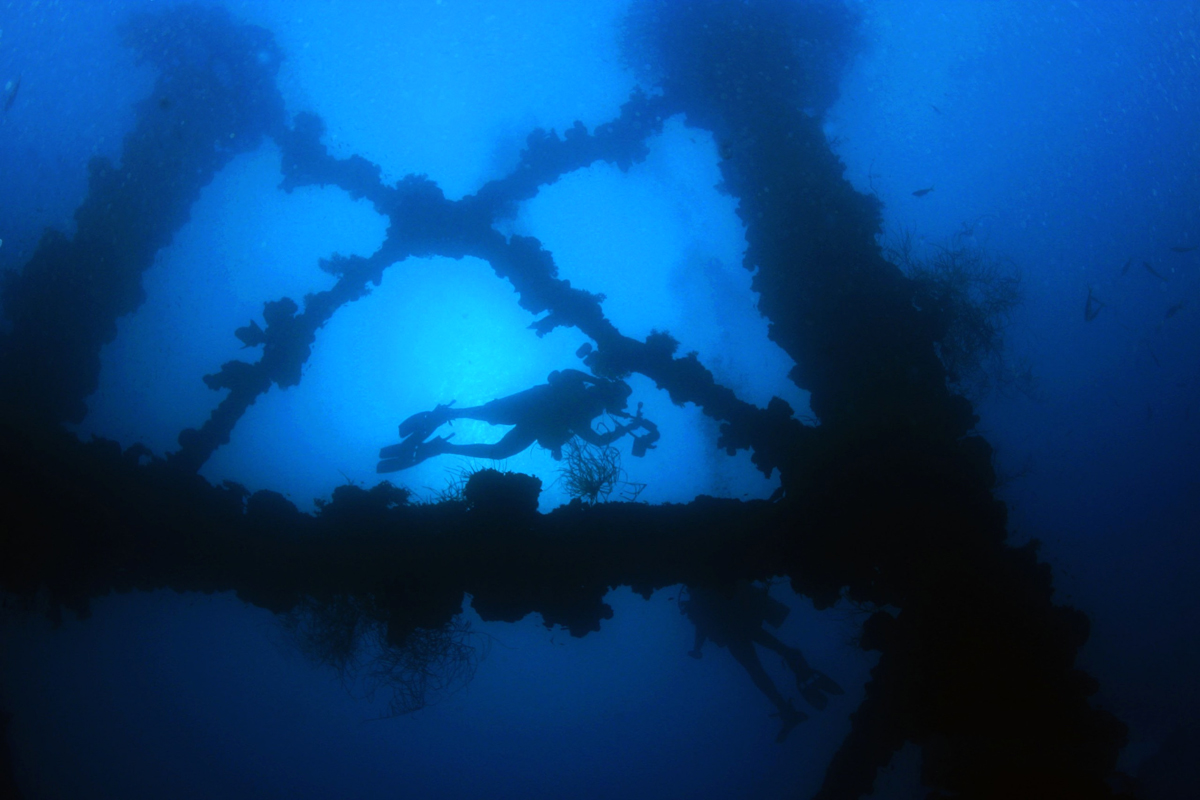 Diver and WWII wreck in Palau