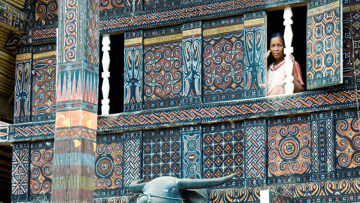 Toraja lady framed in the window of her traditional house