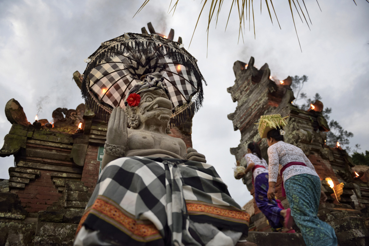 The sculpture of the temple guardian is an icon of Bali