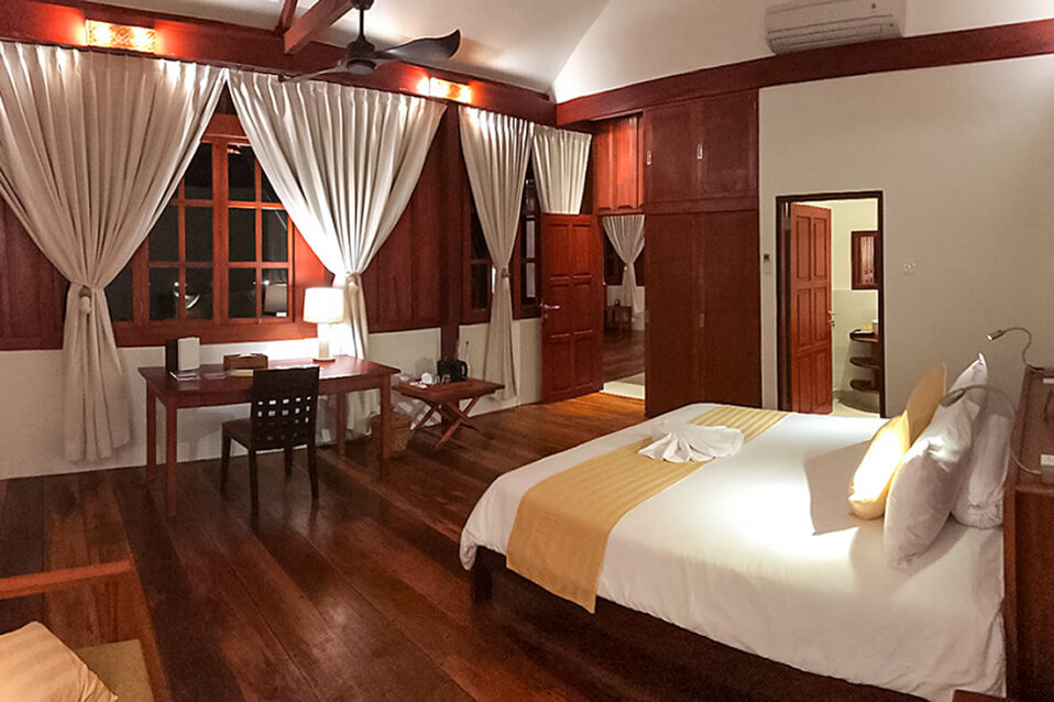 Separate bedrooms at Turtle Beach Bungalow of Wakatobi Dive Resort